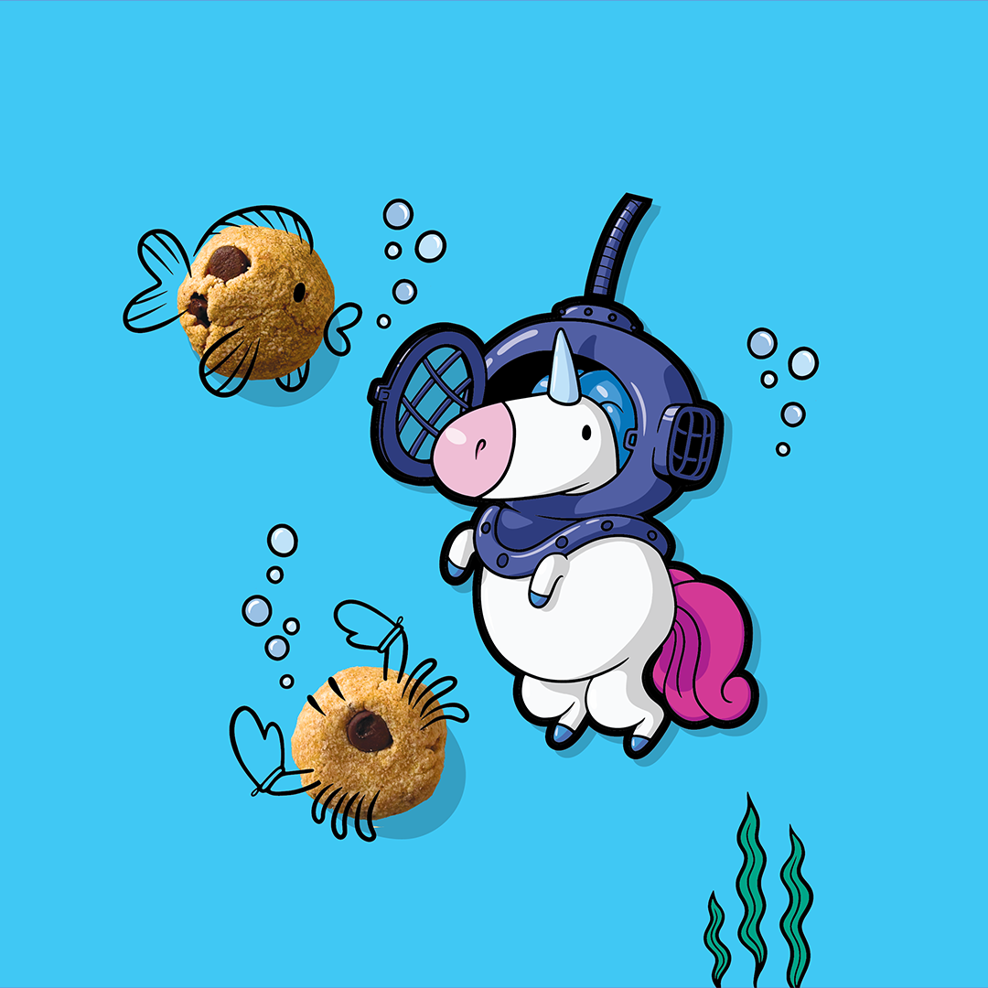 A whimsical illustration on a bright blue background depicts a white unicorn, inspired by Rigatoni, Taylor's Westie, wearing a navy blue deep-sea diving helmet with the visor open, revealing its pink snout and blue horn. It swims alongside two "cookie fish" – round, golden-brown cookies with chocolate chips, outlined in black to resemble fish, complete with fins and tails. Bubbles float around them, and green seaweed grows in the bottom right corner, creating a playful underwater scene.